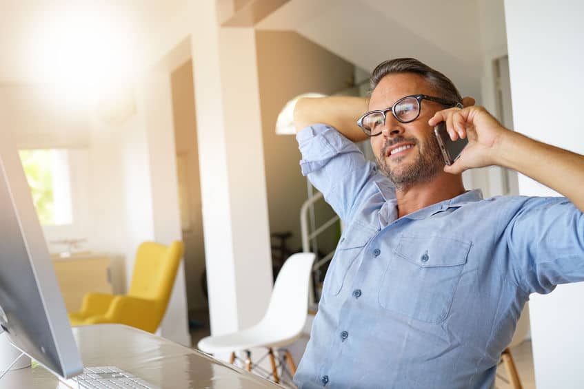 Home-office businessman talking on phone