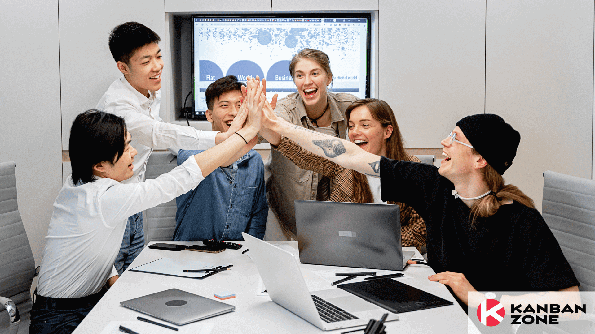 a group of people having a meeting in an office