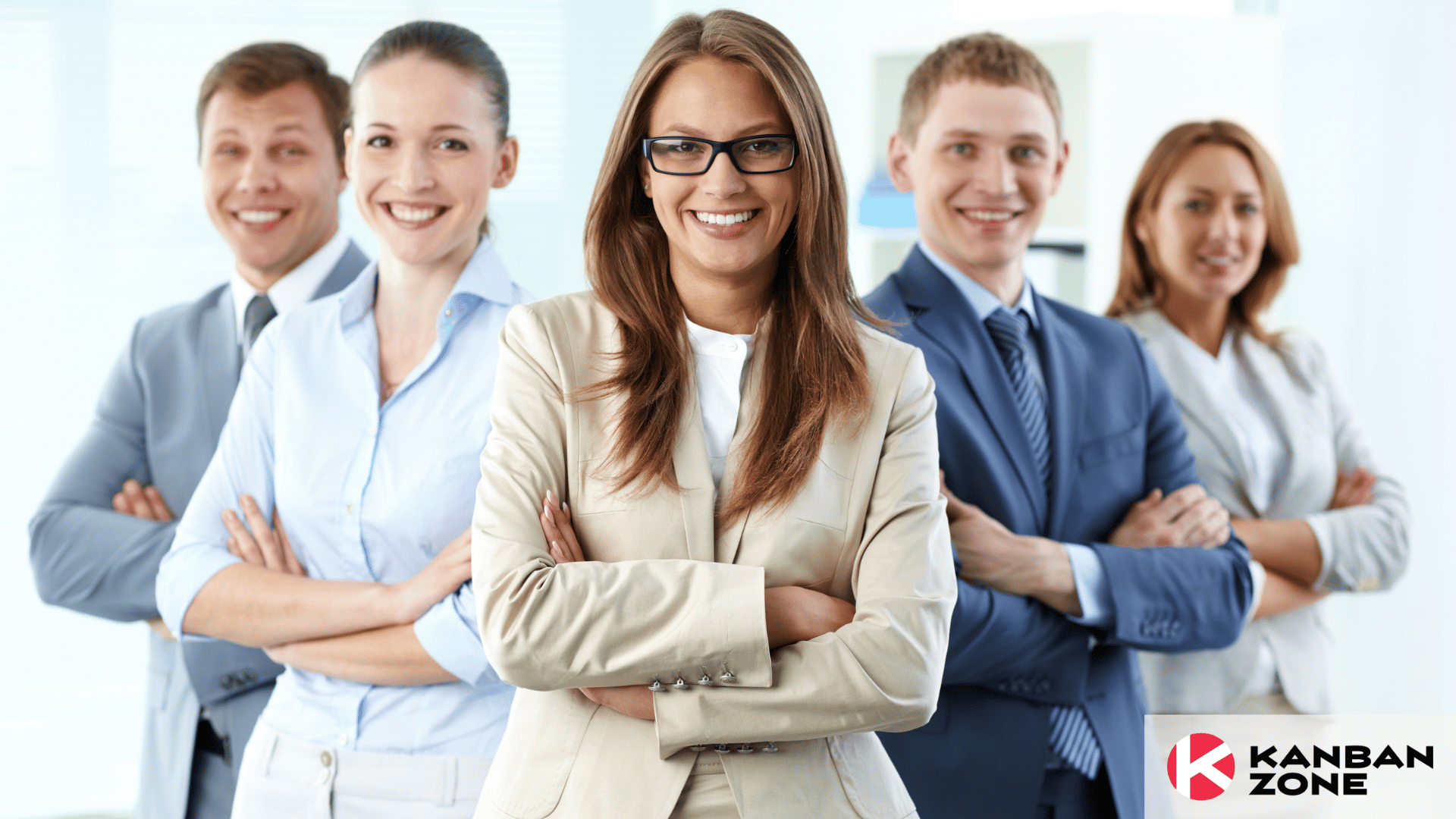 Portrait of 5 business people with female leader in front