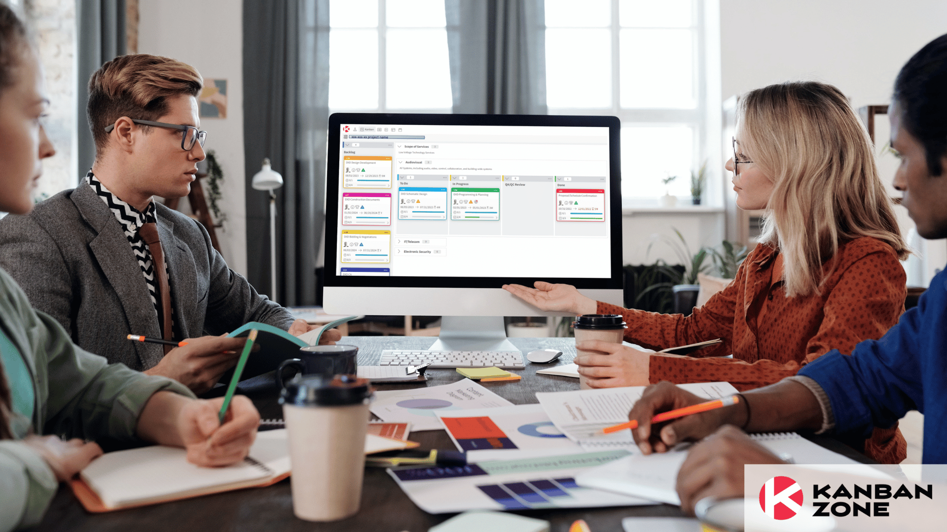 team having a meeting in front of computer