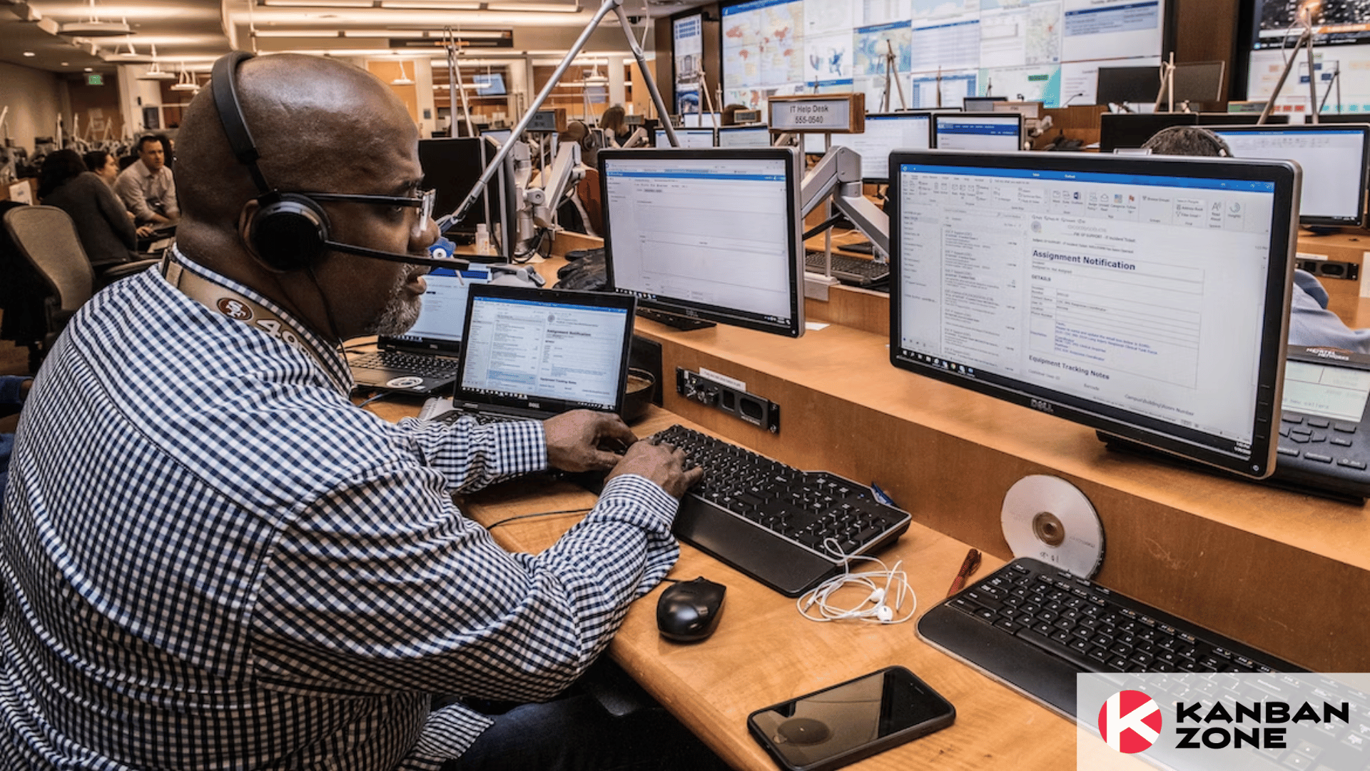 Man using a computer with multiple monitors