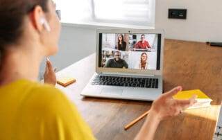 Woman uses laptop for video call indoor